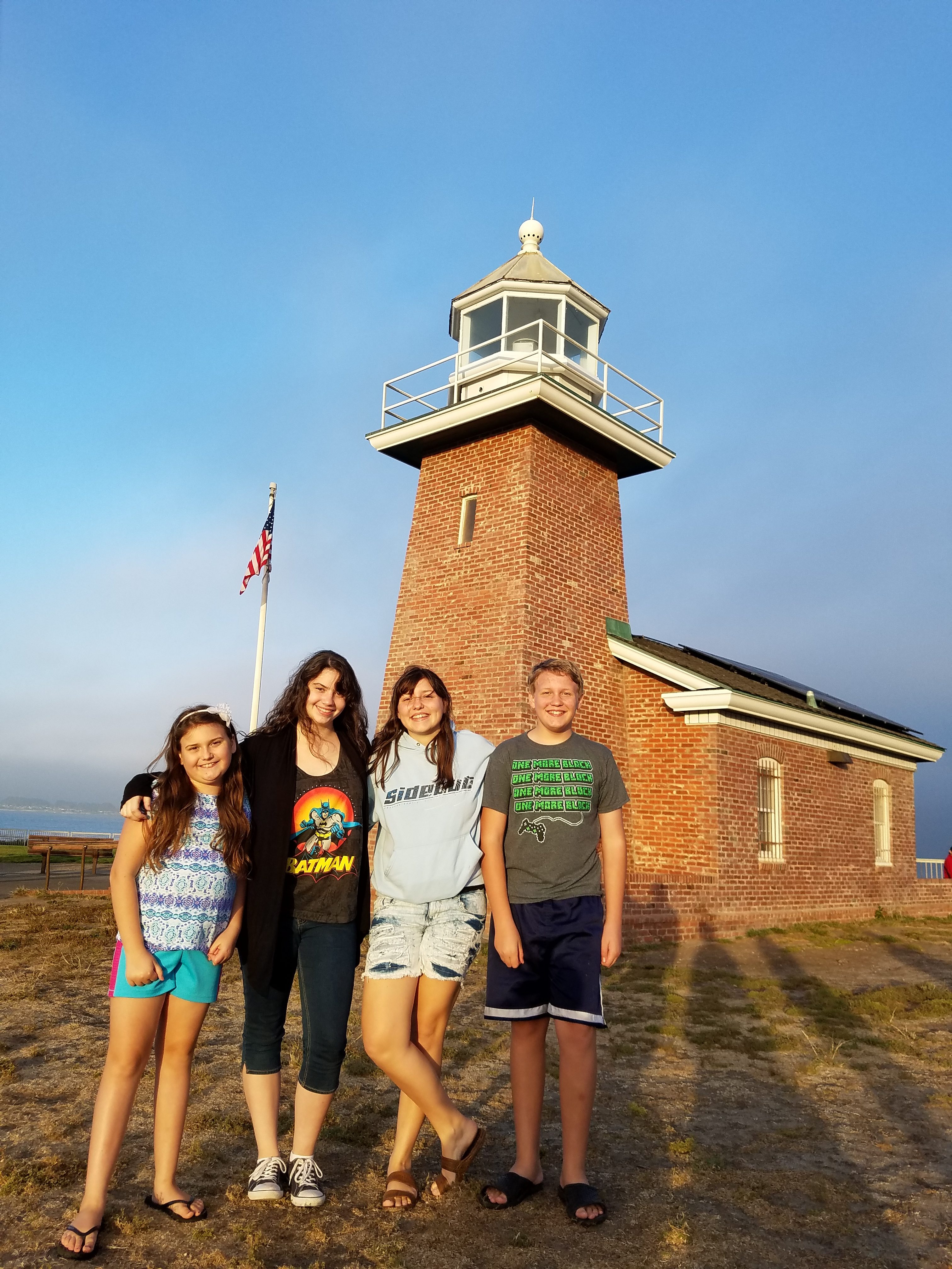 Students in Front of a Lighthouse